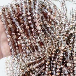 Кришталеві намистини 6х8мм (Рондель) кольору рожеве золото