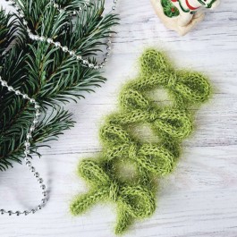 В'язані бантики-шнурочки салатового кольору ручної роботи