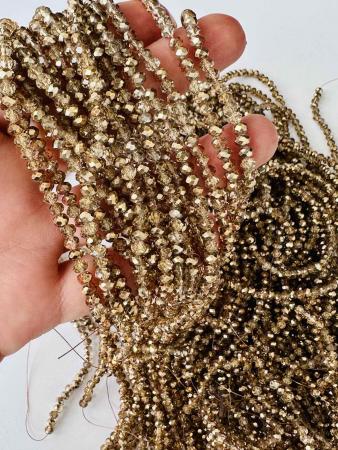 Кришталеві намистини 3,6х4,5мм (Рондель) темно-золотого кольору