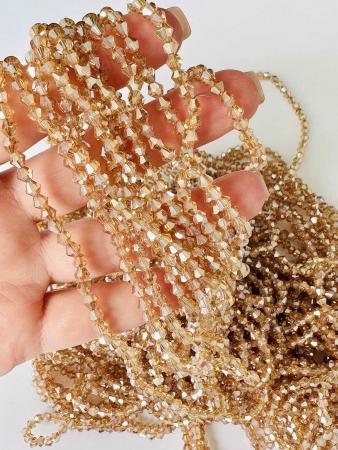 Кришталеві намистини 4,1х4,6мм (Біконус) кольору капучіно