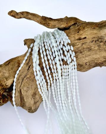 Кришталеві намистини 4,3х8,4мм опалового кольору