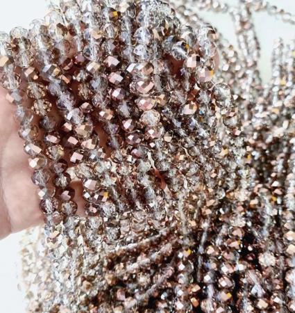 Кришталеві намистини 6х8мм (Рондель) кольору рожеве золото