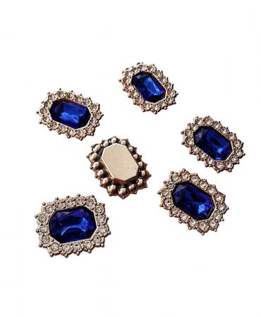 Стразова серединка синього кольору в пластиковій оправі 2,3х2см